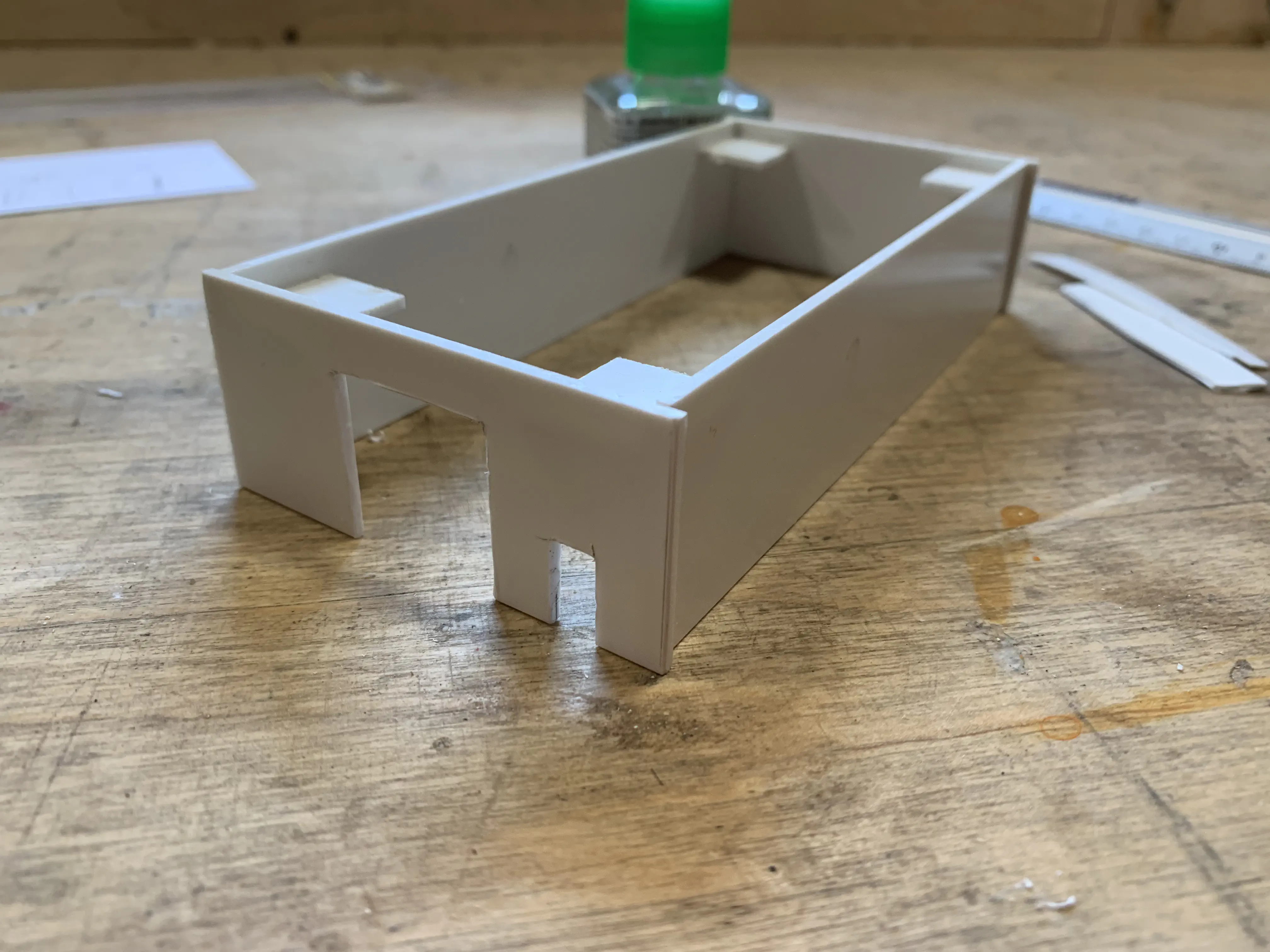 Walls with cutouts for doors and supports in the corners.